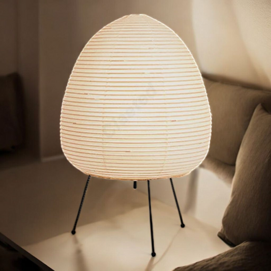 Rice paper egg lamp on bedside table with warm glow