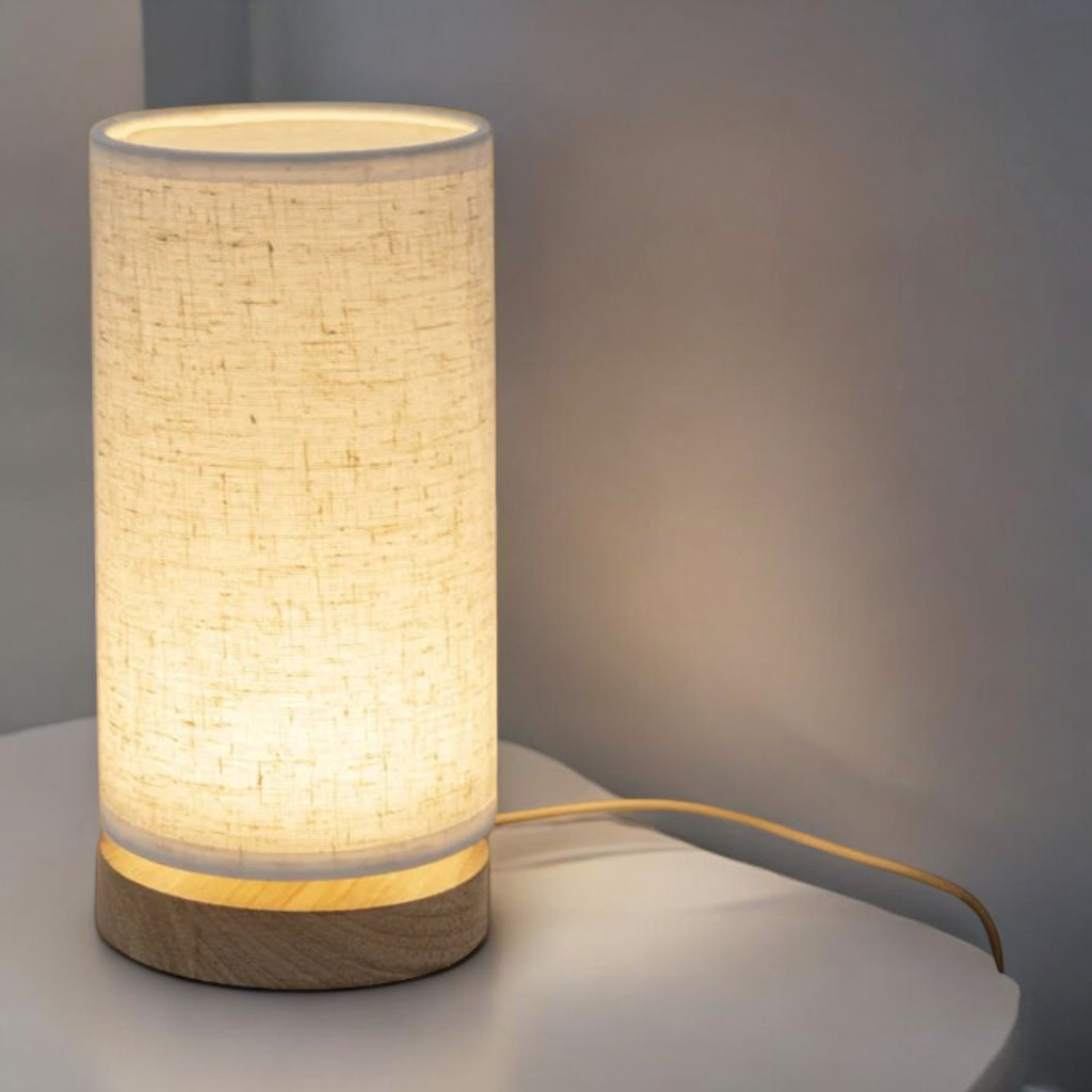 Nordic linen lamp on modern nightstand with warm reading light